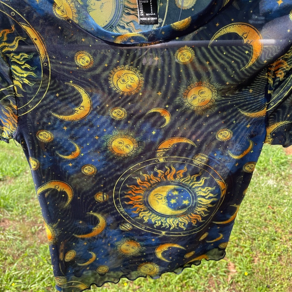 Sheer spiritual theme top